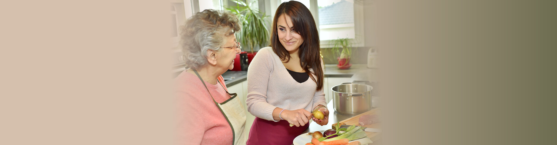 caregiver cooking for an elderly woman